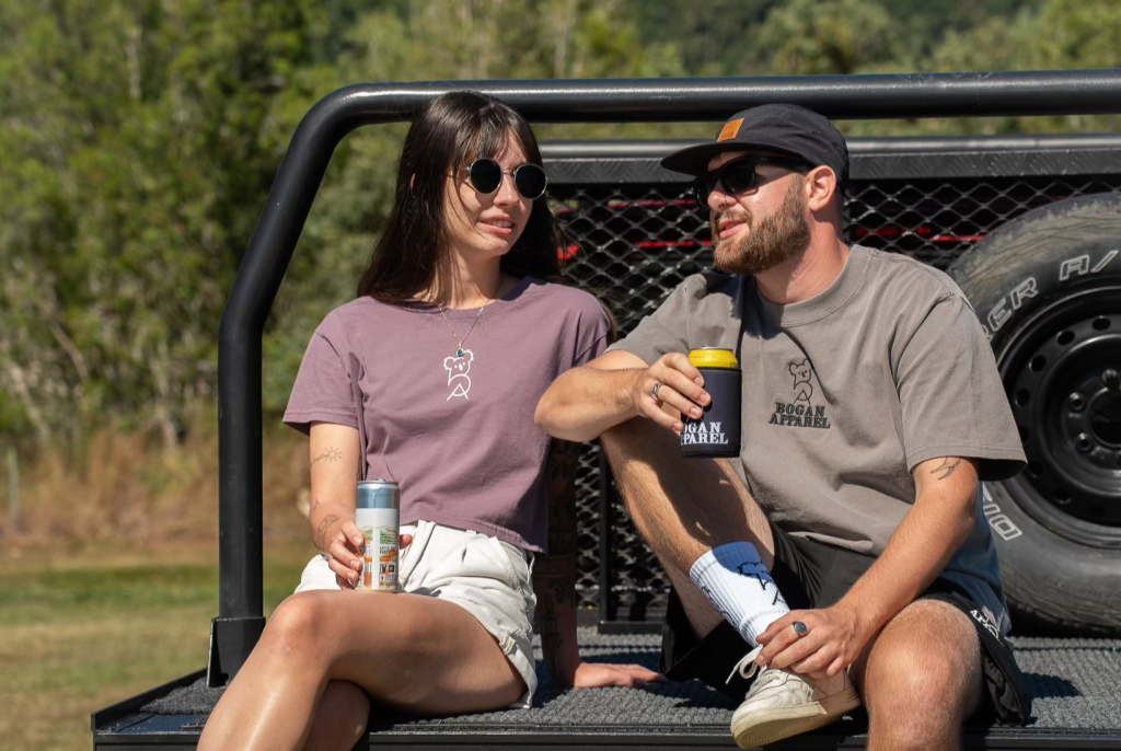 Bogan apparel wear sat in front of car
