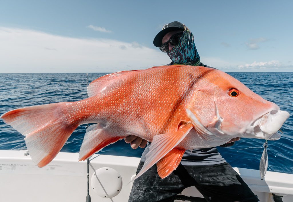 Man fishing holding big fish